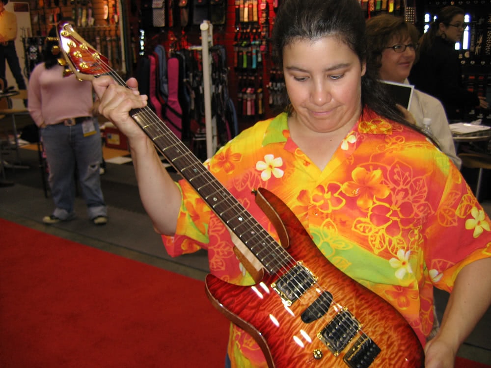 Alicia with a Brian Moore lefty guitar